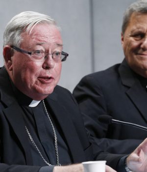 Cardinal Jean-Claude Hollerich of Luxembourg, relator general of the Synod of Bishops, speaks at a news conference to present an update on the synod process, at the Vatican in this Aug. 26, 2022, file photo. Looking on is Cardinal Mario Grech, secretary-general of the synod. The upcoming assembly of the Synod of Bishops will be focused on communion, participation and mission. (CNS photo/Paul Haring)